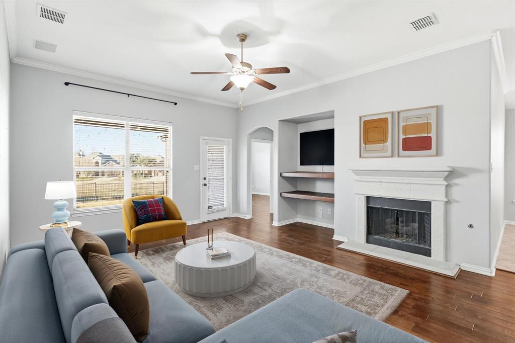 3513 Durango Root Court Fort Worth, TX 76244 - Photo 3 of 34 a living room with furniture and a fireplace