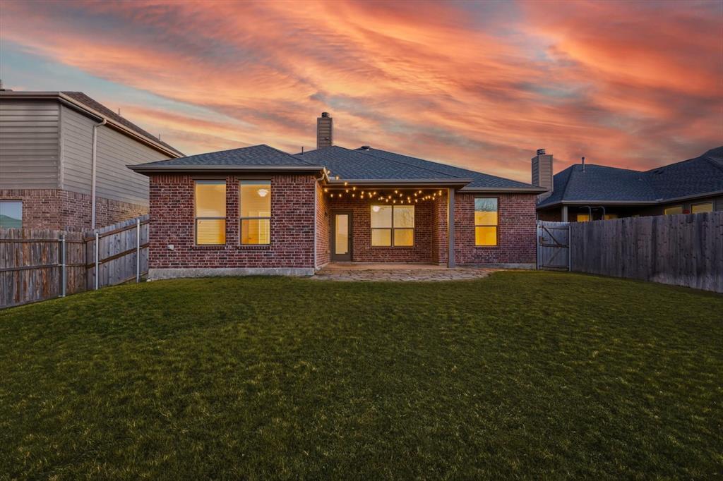 3513 Durango Root Court Fort Worth, TX 76244 - Photo 32 of 34 a front view of a house with a garden