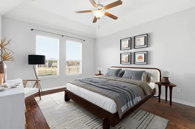 a spacious bedroom with a bed and a window