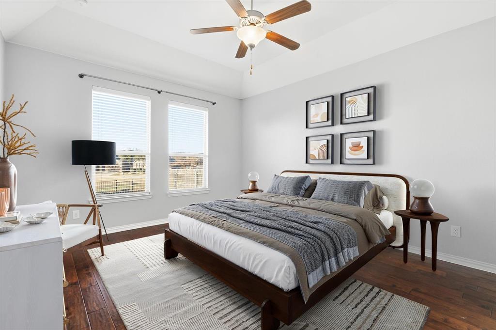 3513 Durango Root Court Fort Worth, TX 76244 - Photo 9 of 34 a spacious bedroom with a bed and a window