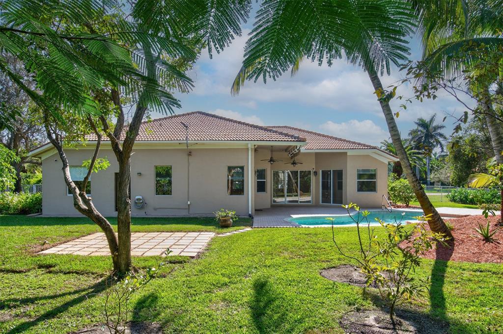 15601 Southwest 15th Street Davie, FL 33326 - Photo 14 of 52 a front view of house with yard and green space