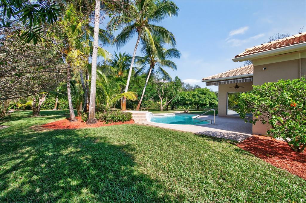 15601 Southwest 15th Street Davie, FL 33326 - Photo 15 of 52 a view of a backyard with a garden