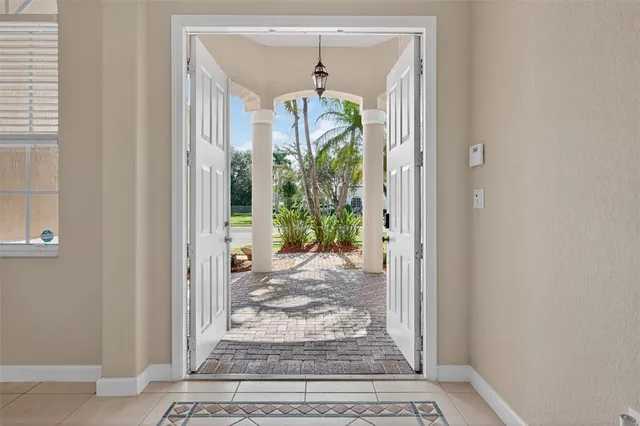 a view of a hallway view with wooden floor and a livingroom view