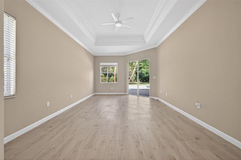15601 Southwest 15th Street Davie, FL 33326 - Photo 30 of 52 wooden floor in an empty room with a window
