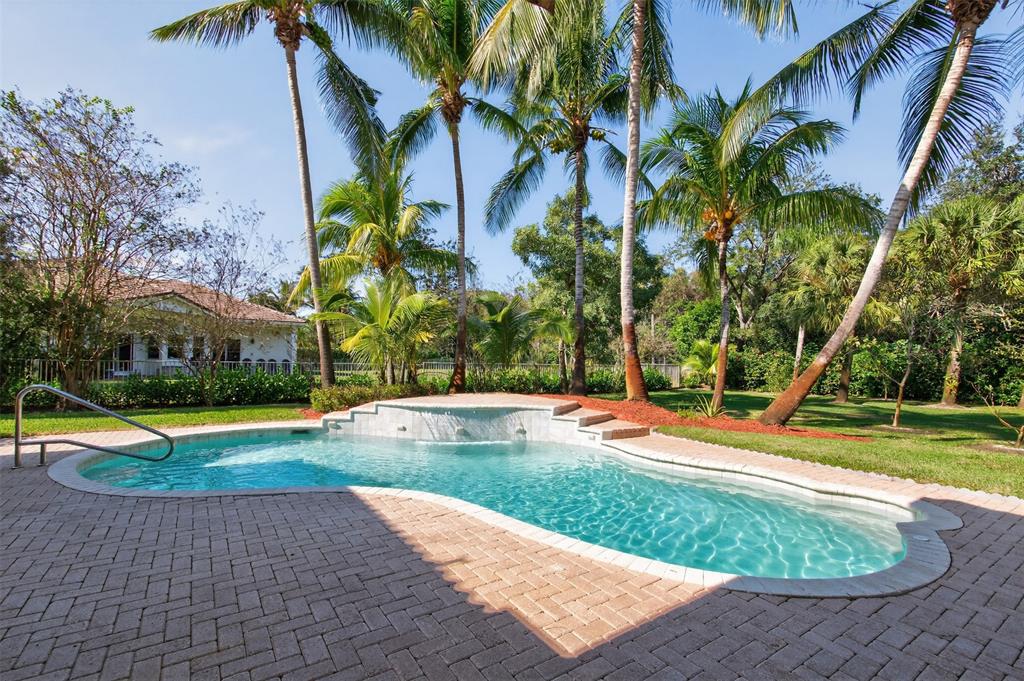 15601 Southwest 15th Street Davie, FL 33326 - Photo 3 of 52 a view of a swimming pool with an outdoor space and seating area