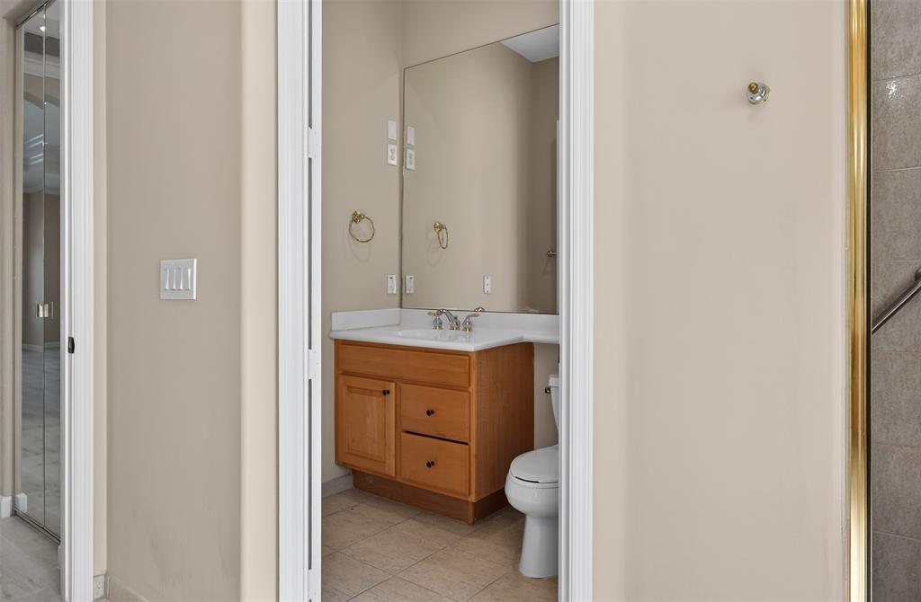 15601 Southwest 15th Street Davie, FL 33326 - Photo 34 of 52 a bathroom with a granite countertop sink toilet and shower