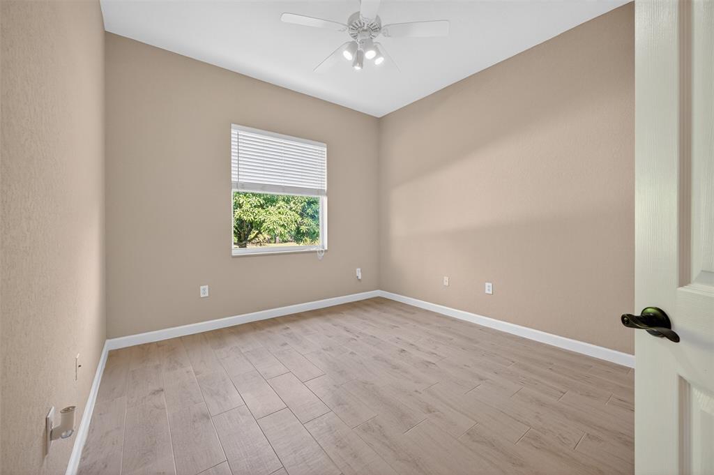 15601 Southwest 15th Street Davie, FL 33326 - Photo 36 of 52 an empty room with windows and entrance