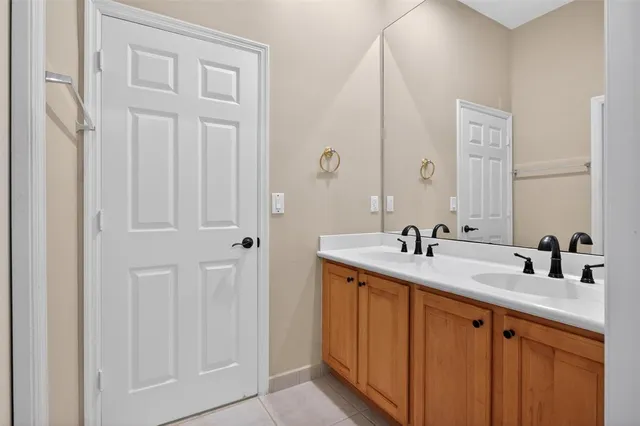 a white toilet sitting next to a bathroom sink