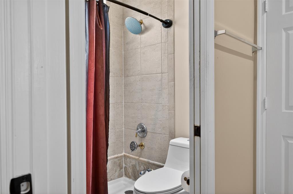 15601 Southwest 15th Street Davie, FL 33326 - Photo 40 of 52 a white toilet sitting next to a bathroom sink