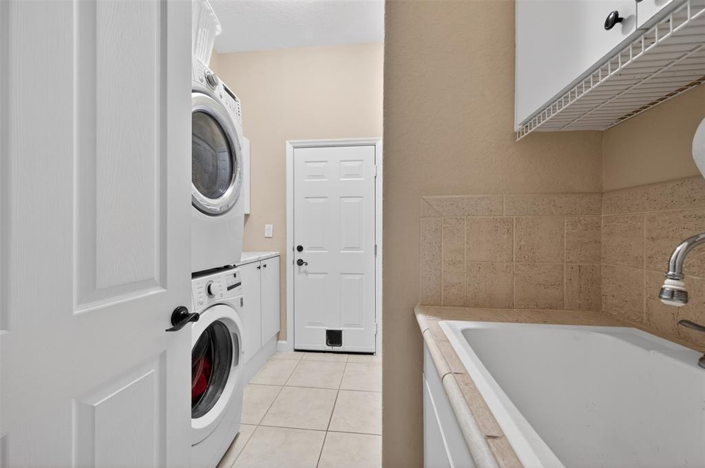 15601 Southwest 15th Street Davie, FL 33326 - Photo 43 of 52 a utility room with dryer and washer