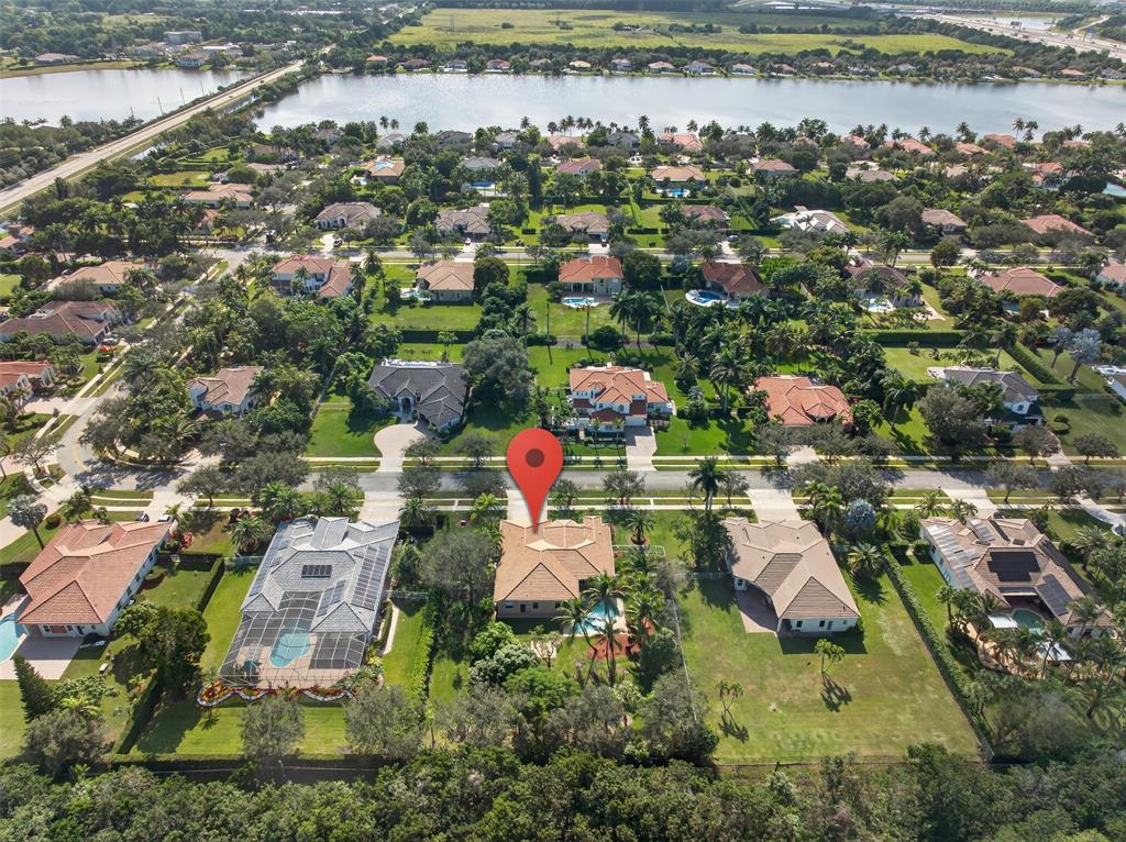 15601 Southwest 15th Street Davie, FL 33326 - Photo 45 of 52 an aerial view of residential houses with outdoor space and swimming pool