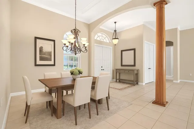 a dining room with furniture and window