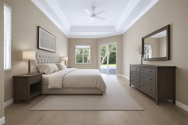 a bedroom with a large bed and a chandelier