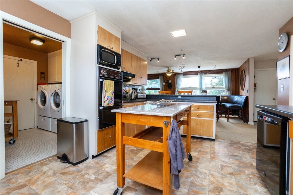 6 Leo Road Marblehead, MA 01945 - Photo 15 of 36 a kitchen with stainless steel appliances granite countertop a stove refrigerator and cabinets