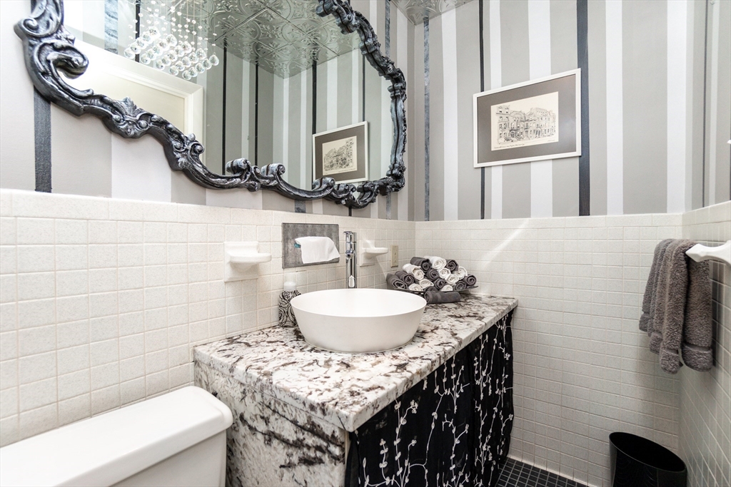 6 Leo Road Marblehead, MA 01945 - Photo 17 of 36 a bathroom with a sink and a mirror