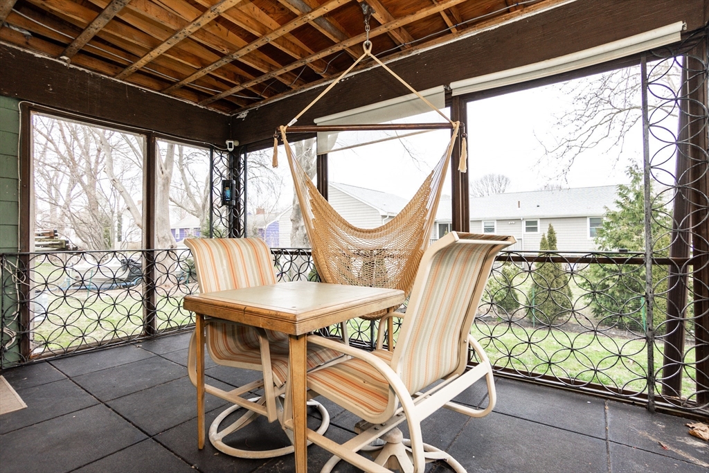 6 Leo Road Marblehead, MA 01945 - Photo 18 of 36 a dining room with furniture a chandelier and wooden floor