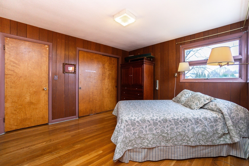 6 Leo Road Marblehead, MA 01945 - Photo 25 of 36 a bedroom with a bed and a large window