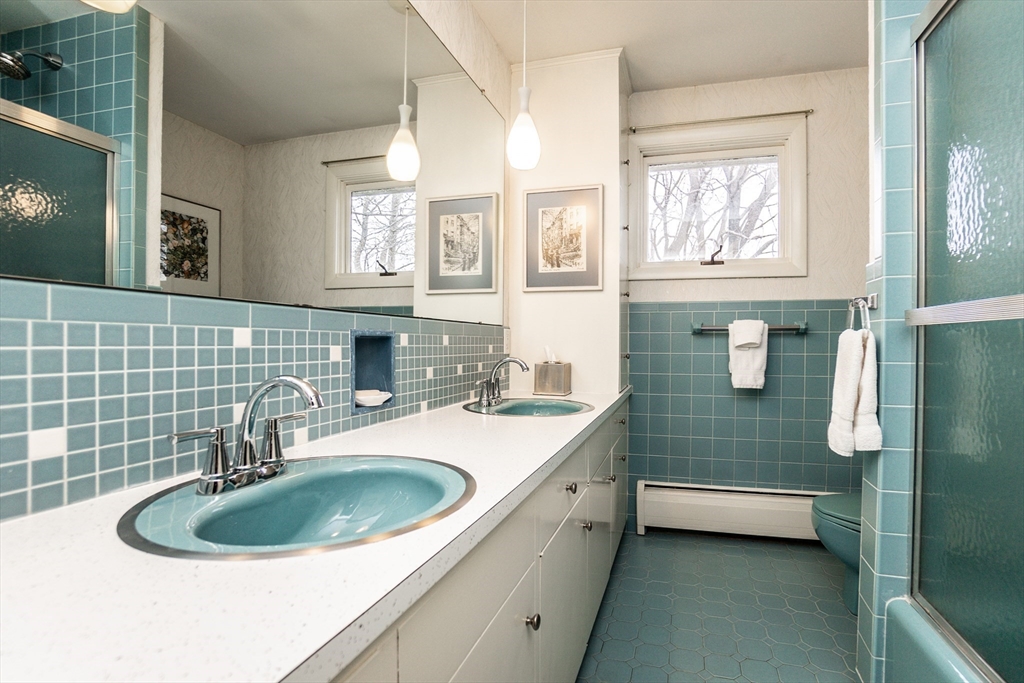 6 Leo Road Marblehead, MA 01945 - Photo 26 of 36 a bathroom with a sink a mirror and a bathtub