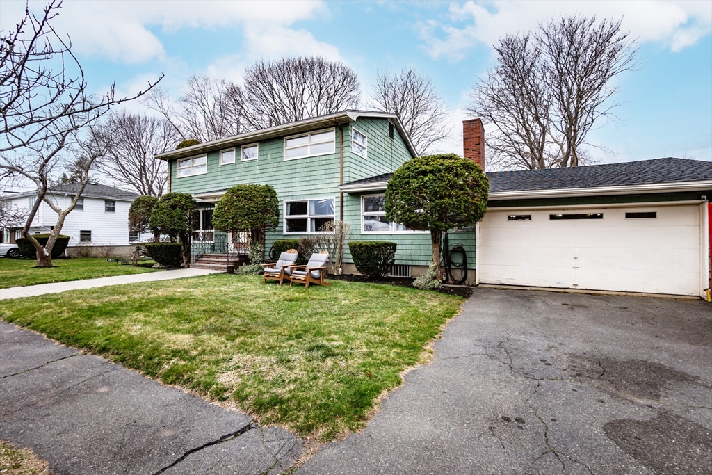 6 Leo Road Marblehead, MA 01945 - Photo 3 of 36 a front view of a house with garden