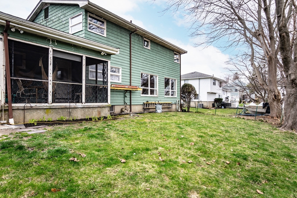 6 Leo Road Marblehead, MA 01945 - Photo 33 of 36 a view of a house with a yard and sitting area