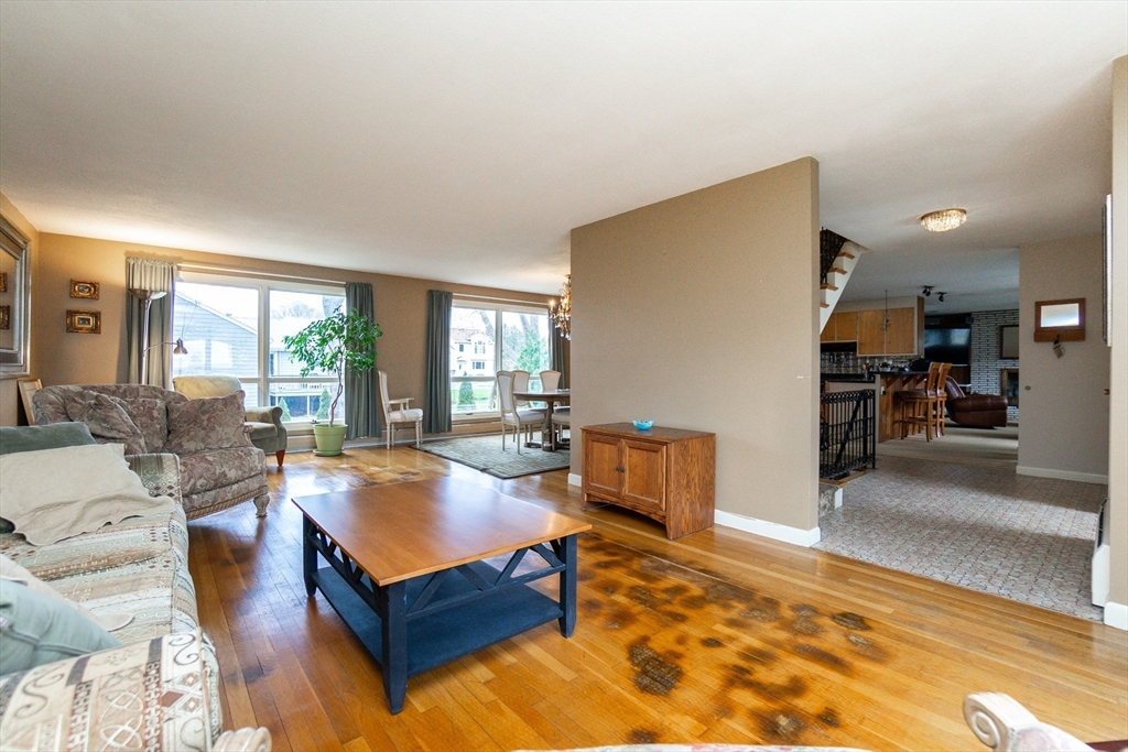 6 Leo Road Marblehead, MA 01945 - Photo 5 of 36 a living room with furniture pool table and a large window