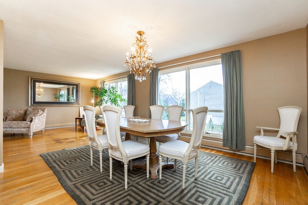 6 Leo Road Marblehead, MA 01945 - Photo 8 of 36 a view of a dining room with furniture a chandelier and wooden floor