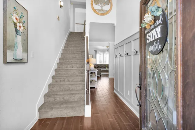 a view of entryway with wooden floor