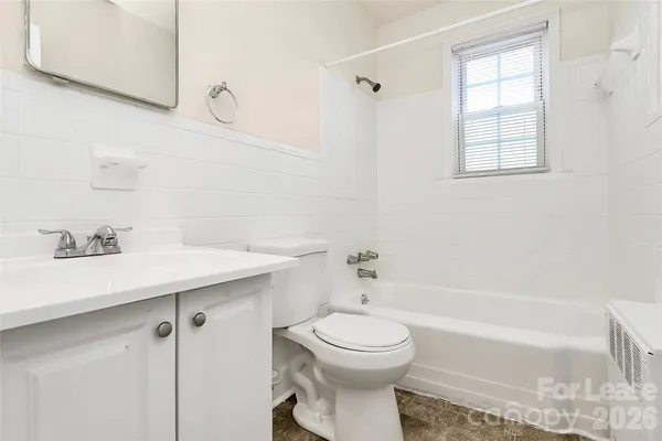 a bathroom with a sink a toilet and bathtub