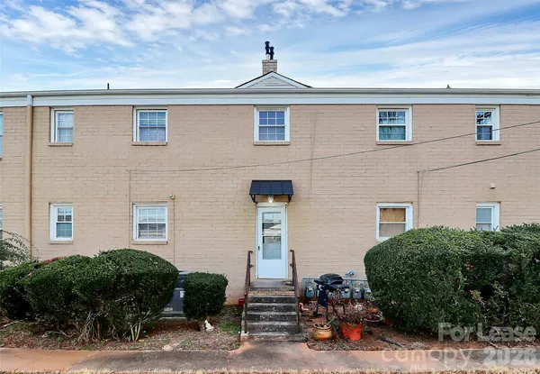 a front view of a house with garage