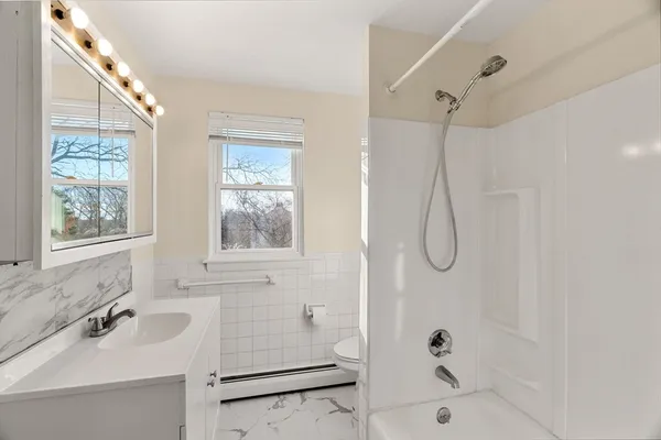 a bathroom with a sink and a window