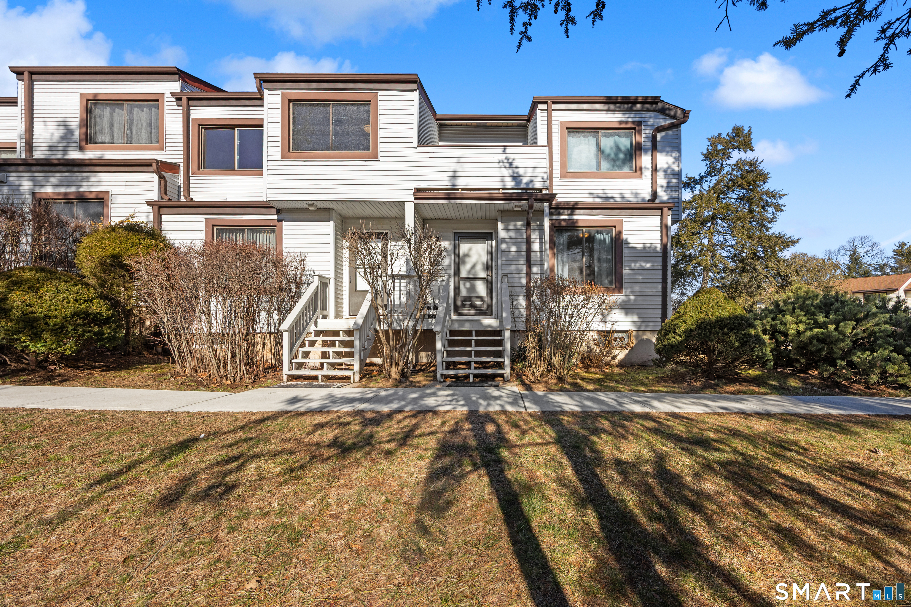 229 Cottonwood Road, Unit 229 Newington, CT 06111 - Photo 1 of 24 a view of a house with a patio