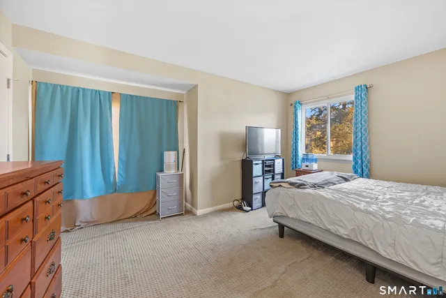 a bedroom with a bed and a cabinets