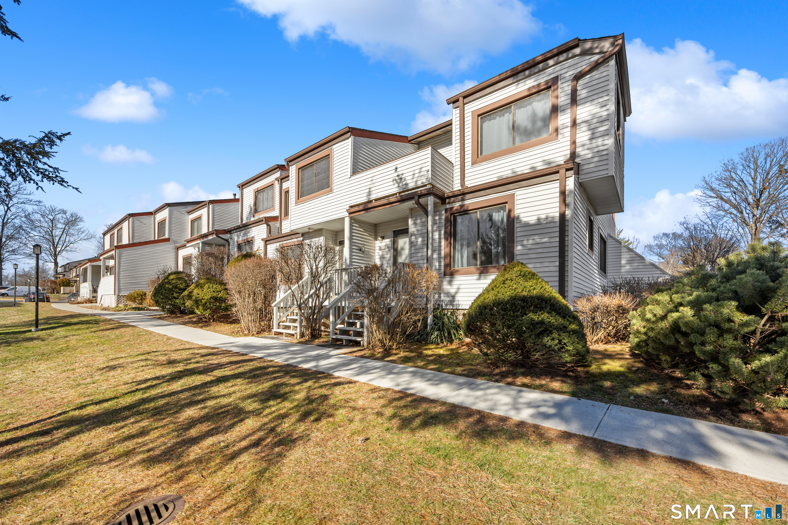 229 Cottonwood Road, Unit 229 Newington, CT 06111 - Photo 24 of 24 a front view of a house with a yard