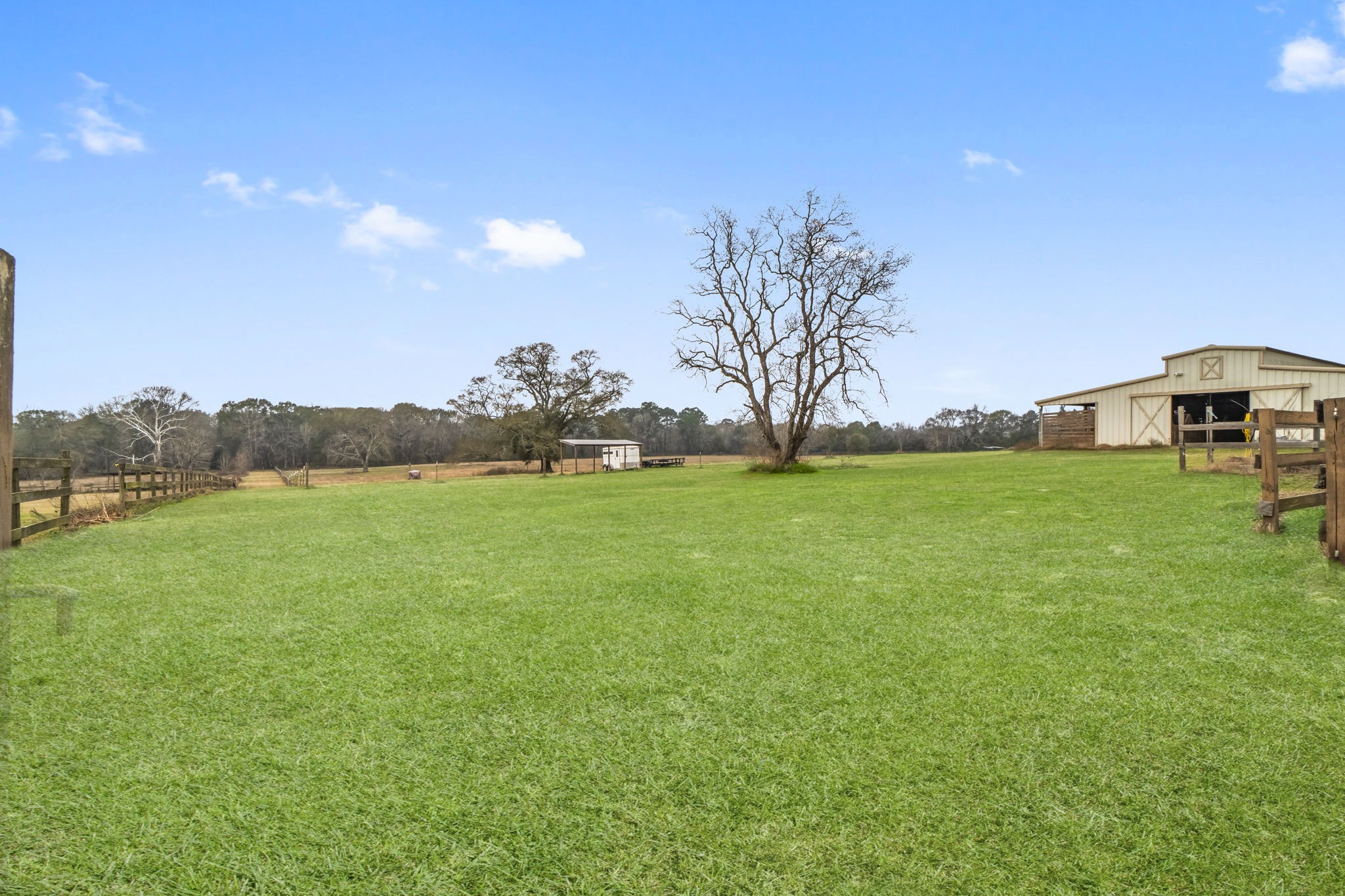 a view of yard with swimming pool and green space