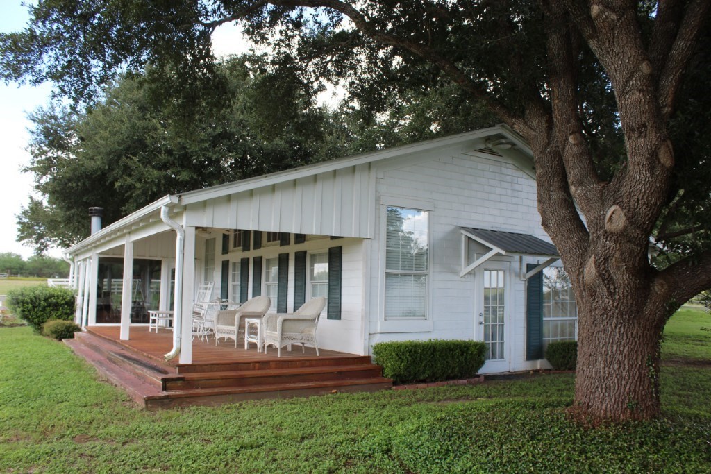 14808 Whitman Road, Unit 2 Washington, TX 77880 - Photo 10 of 11 a view of a house with backyard and a tree