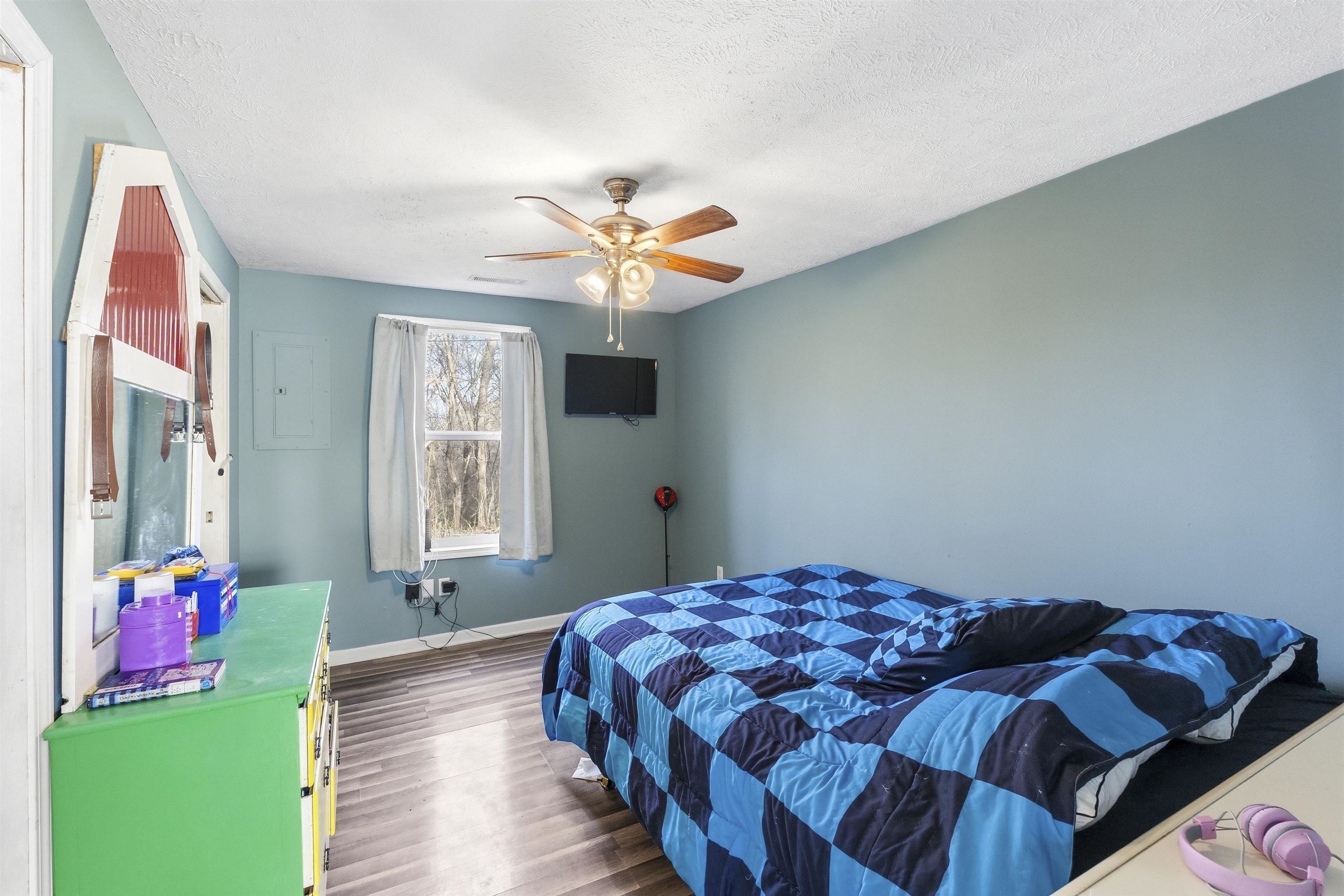 291 Central Curve Road Ripley, TN 38063 - Photo 11 of 13 a bedroom with a bed and a chandelier