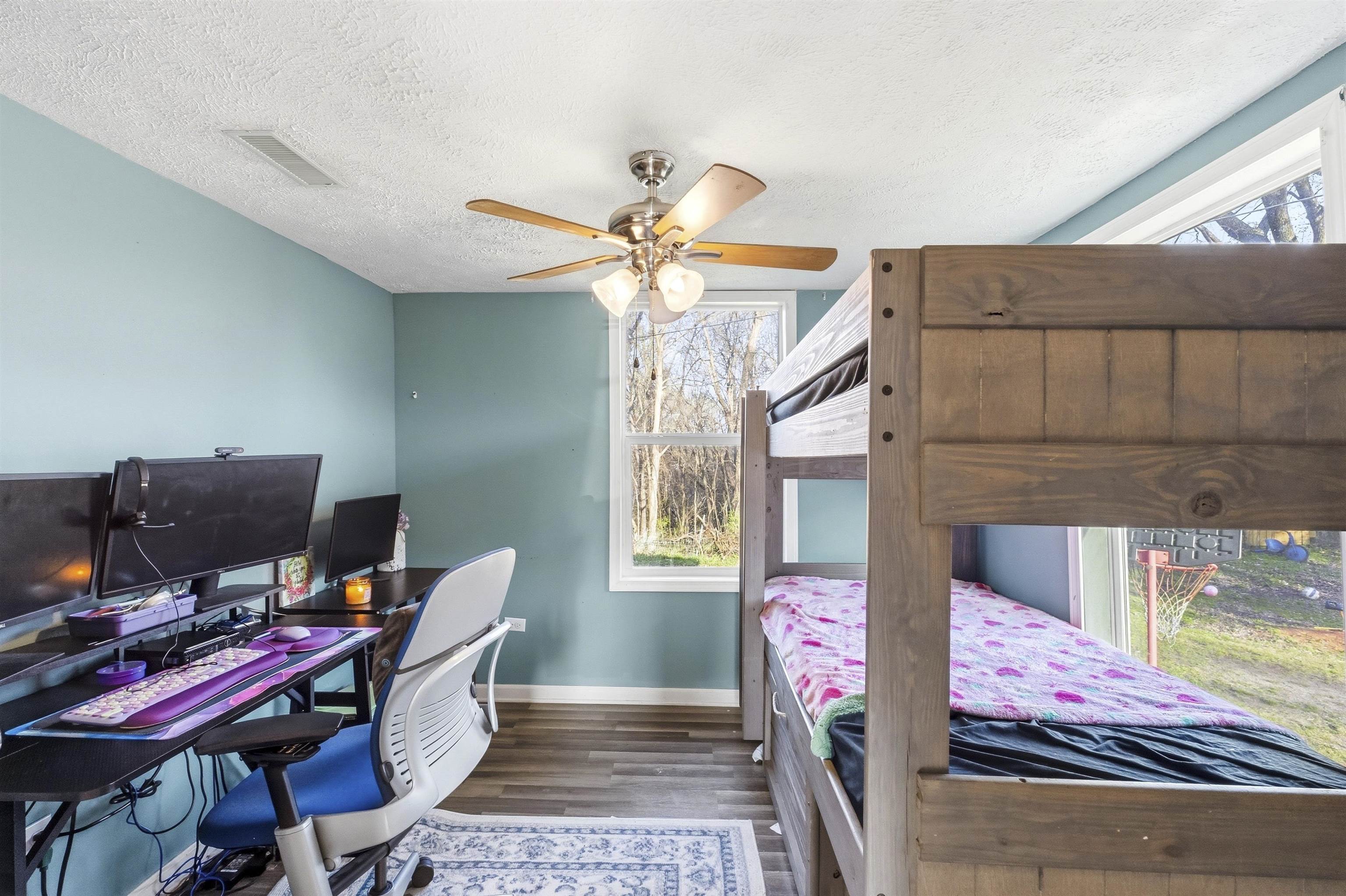 291 Central Curve Road Ripley, TN 38063 - Photo 12 of 13 Bedroom with dark wood-style flooring, an office area, a textured ceiling, and ceiling fan