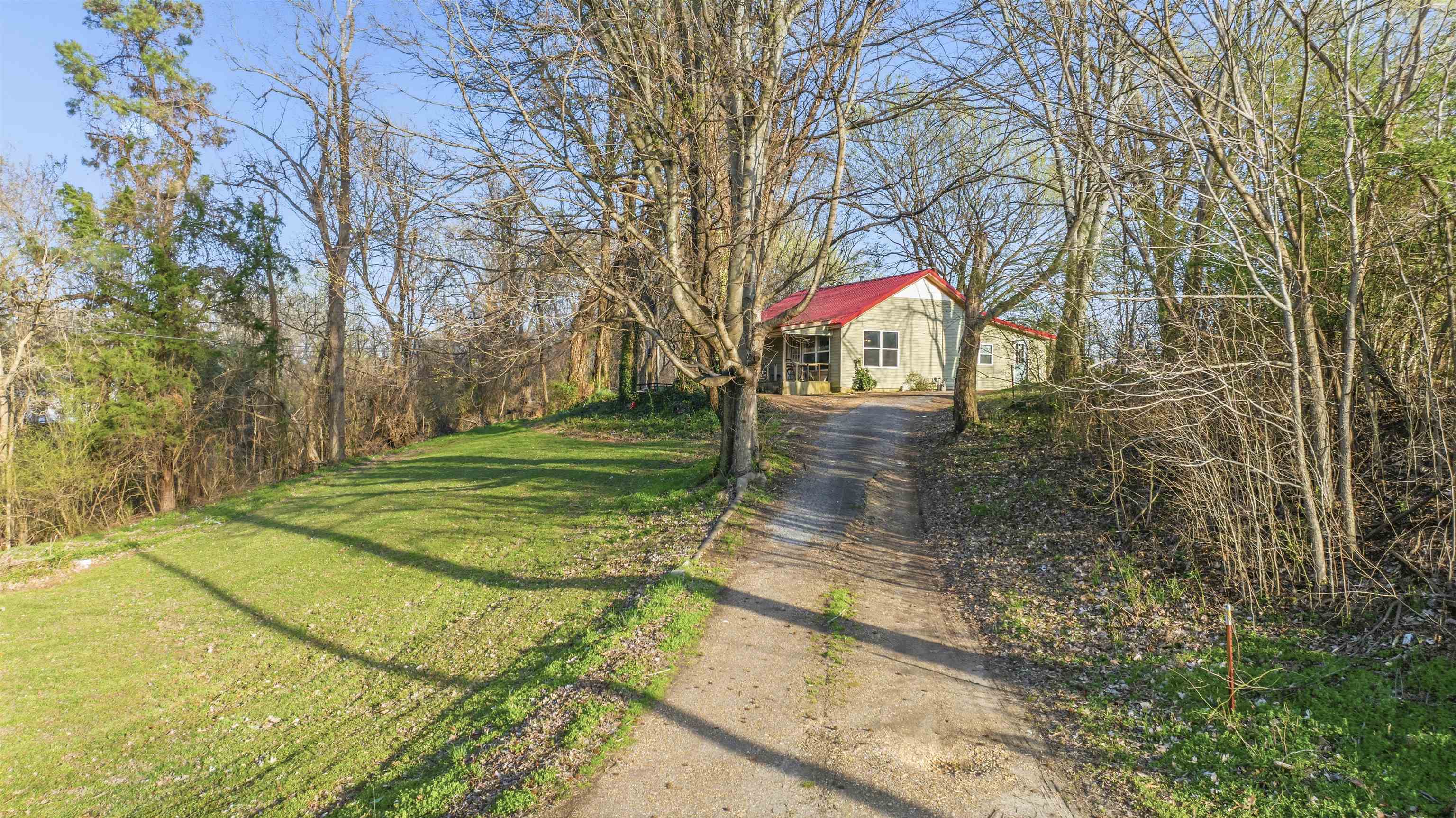 291 Central Curve Road Ripley, TN 38063 - Photo 2 of 13 a backyard of a house with lots of green space