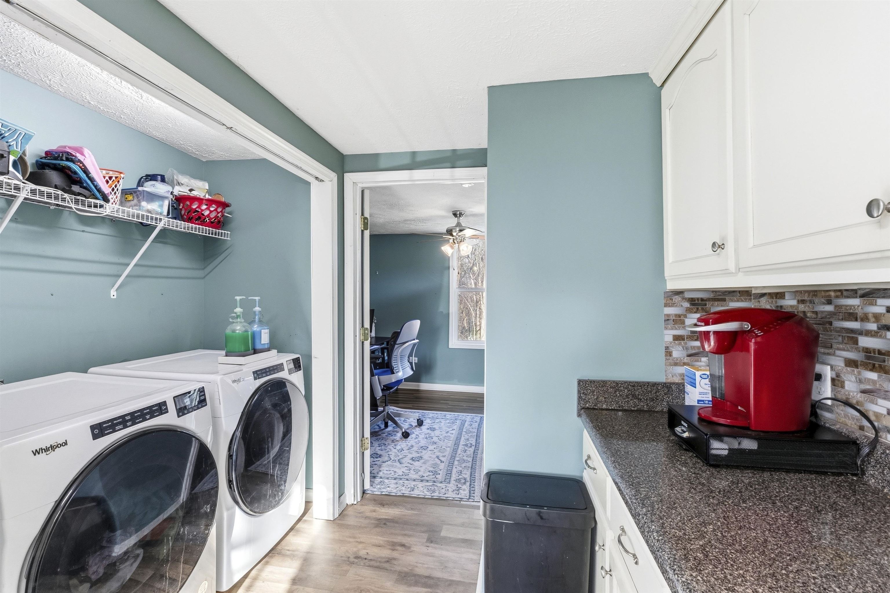 291 Central Curve Road Ripley, TN 38063 - Photo 6 of 13 a utility room with dryer washer and a view of living room