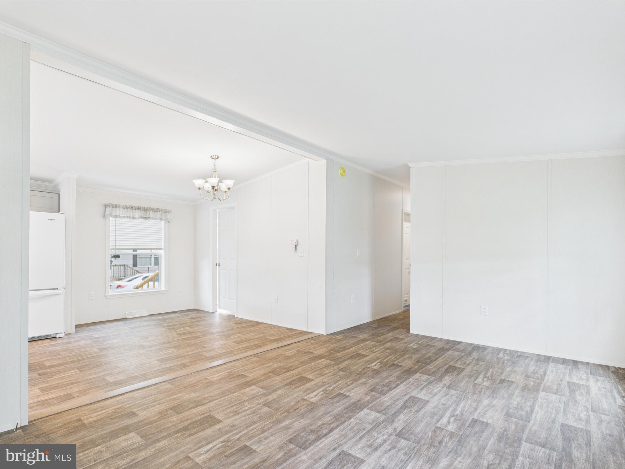 140 Pawnee Avenue Dover, PA 17315 - Photo 12 of 31 an empty room with wooden floor and windows