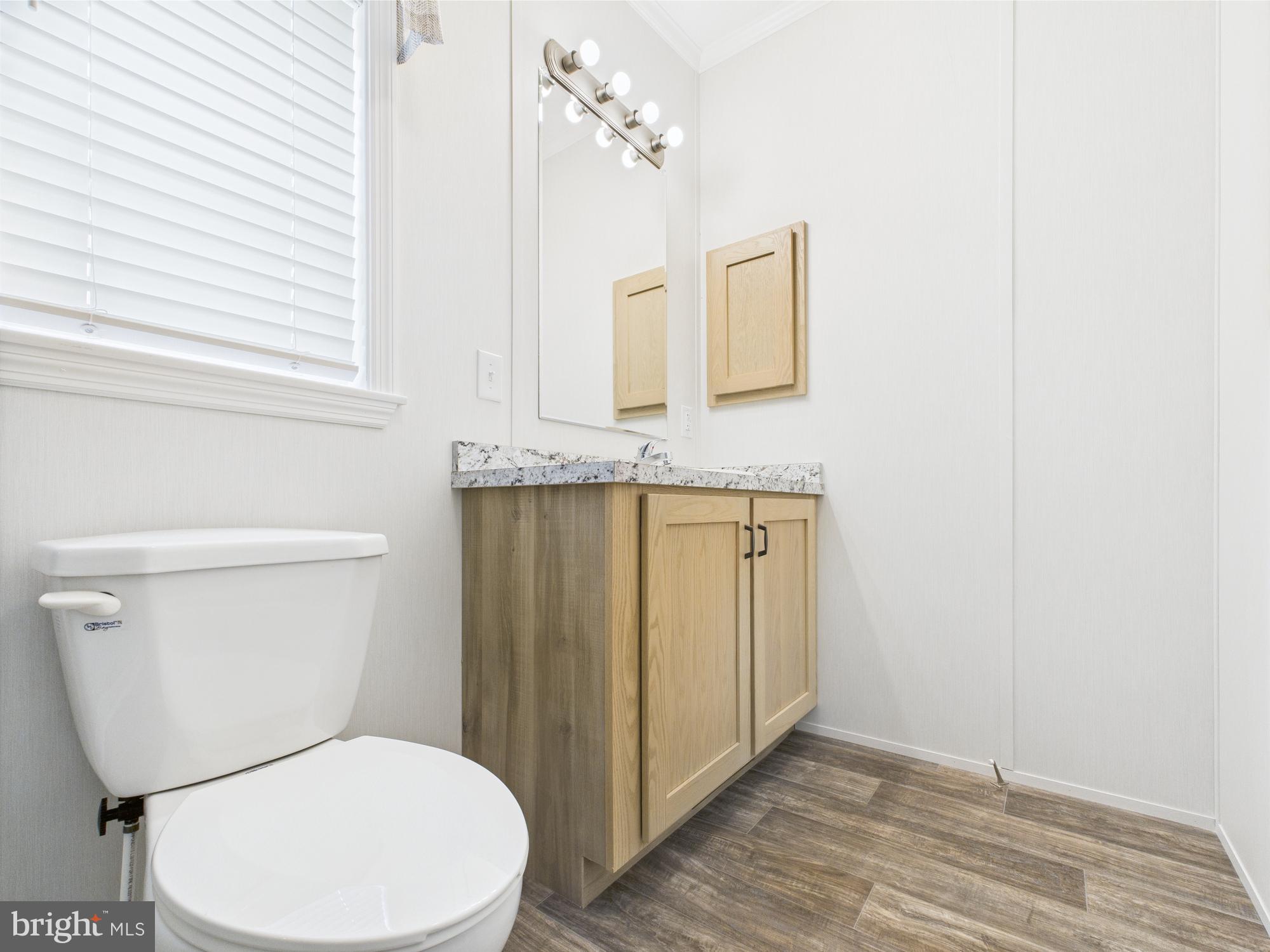 140 Pawnee Avenue Dover, PA 17315 - Photo 23 of 31 a bathroom with a toilet a sink and mirror