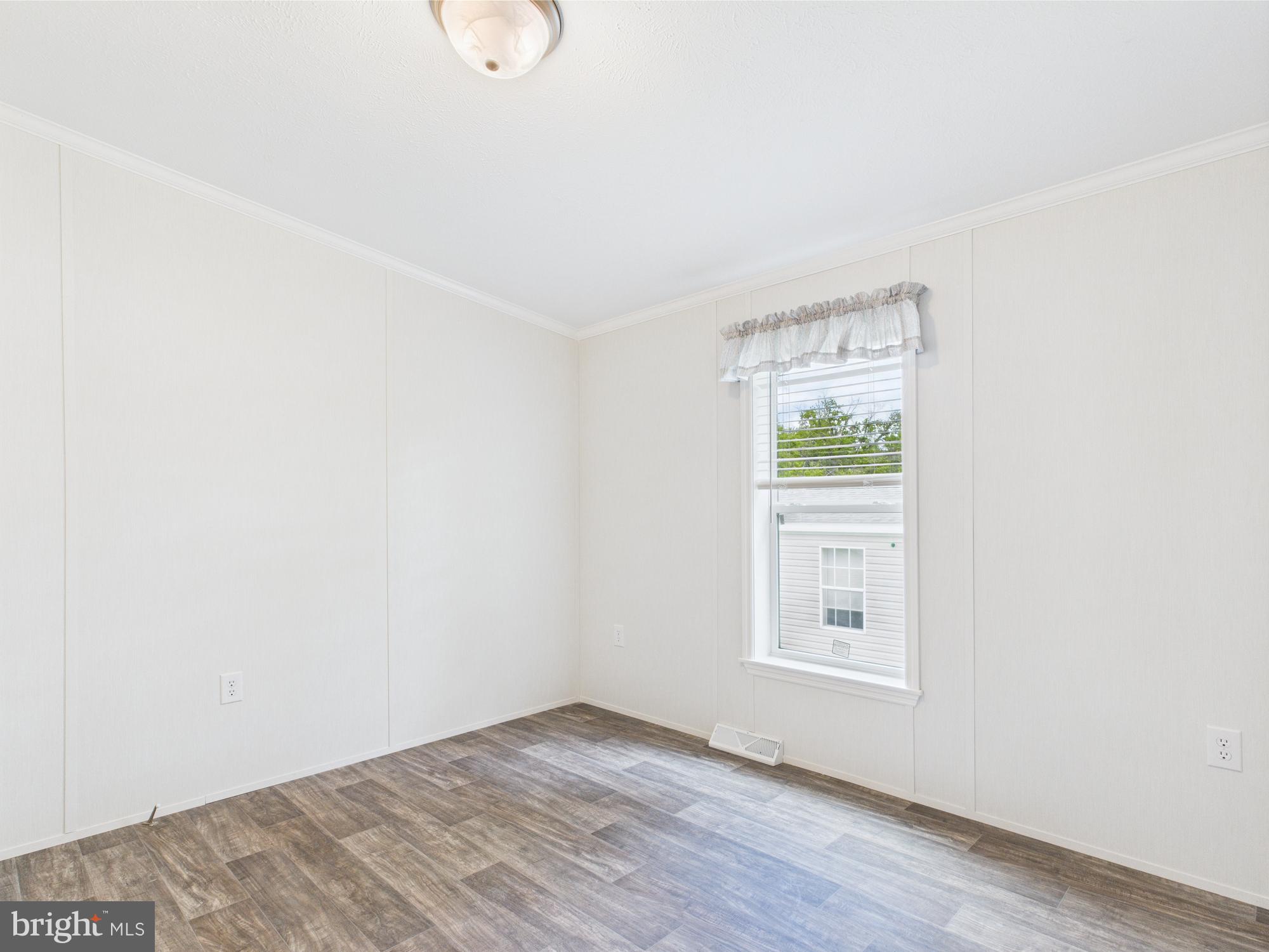 140 Pawnee Avenue Dover, PA 17315 - Photo 26 of 31 a view of an empty room with wooden floor and a window