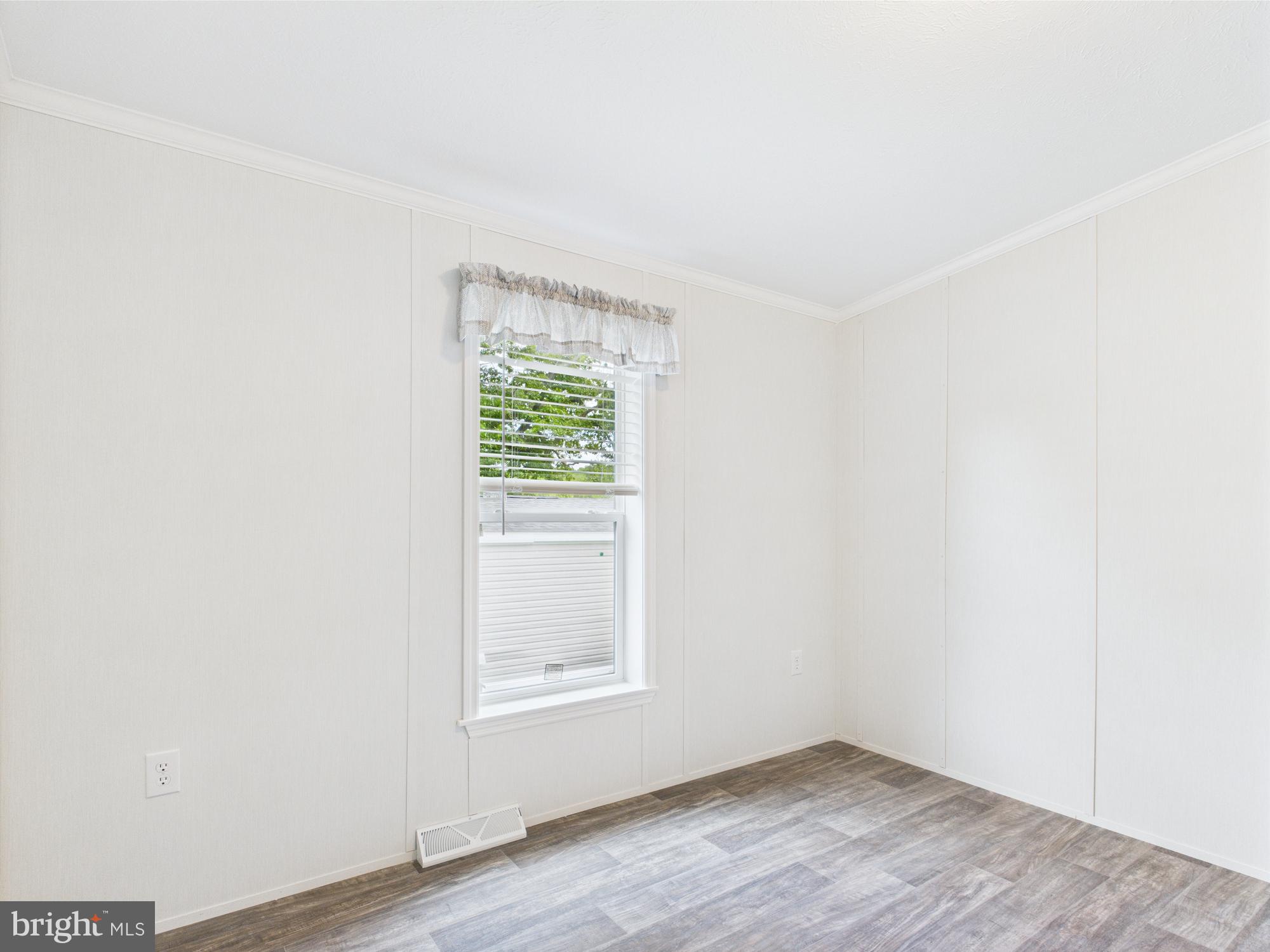 140 Pawnee Avenue Dover, PA 17315 - Photo 28 of 31 a view of an empty room with wooden floor and a window