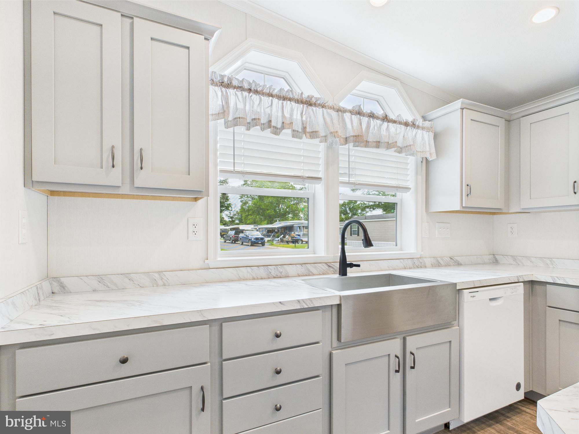 140 Pawnee Avenue Dover, PA 17315 - Photo 6 of 31 a kitchen with granite countertop white cabinets and a window