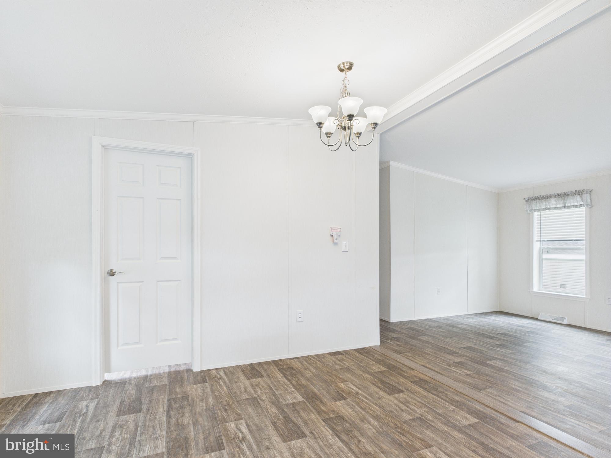 140 Pawnee Avenue Dover, PA 17315 - Photo 10 of 31 wooden floor in an empty room with a window