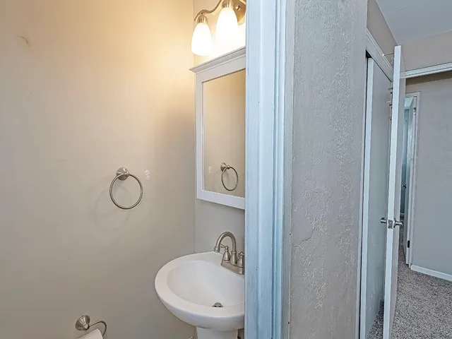 a bathroom with a sink and mirror