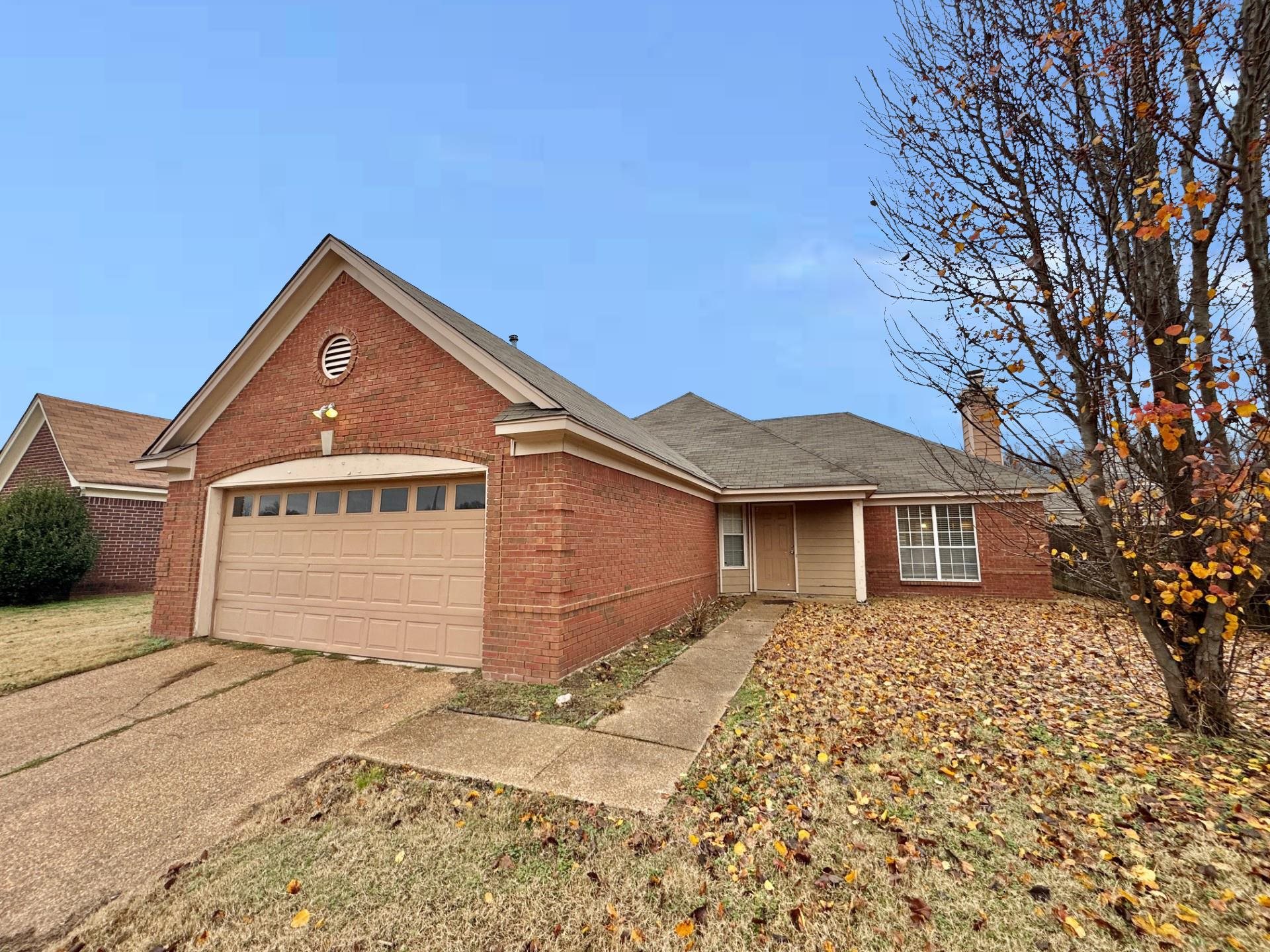 76 Autumn Branch Lane Memphis, TN 38109 - Photo 1 of 13 View of front of house featuring a garage