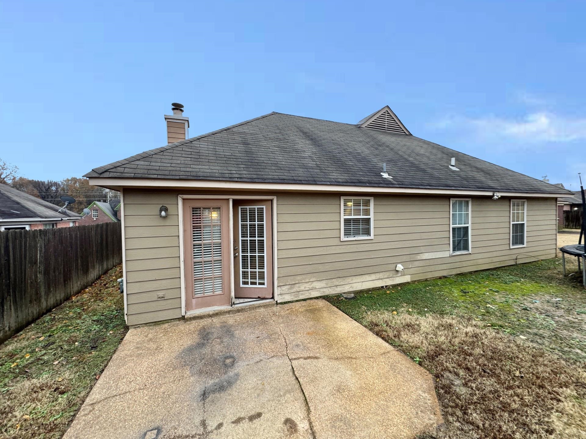 76 Autumn Branch Lane Memphis, TN 38109 - Photo 12 of 13 Back of property with a patio and a trampoline