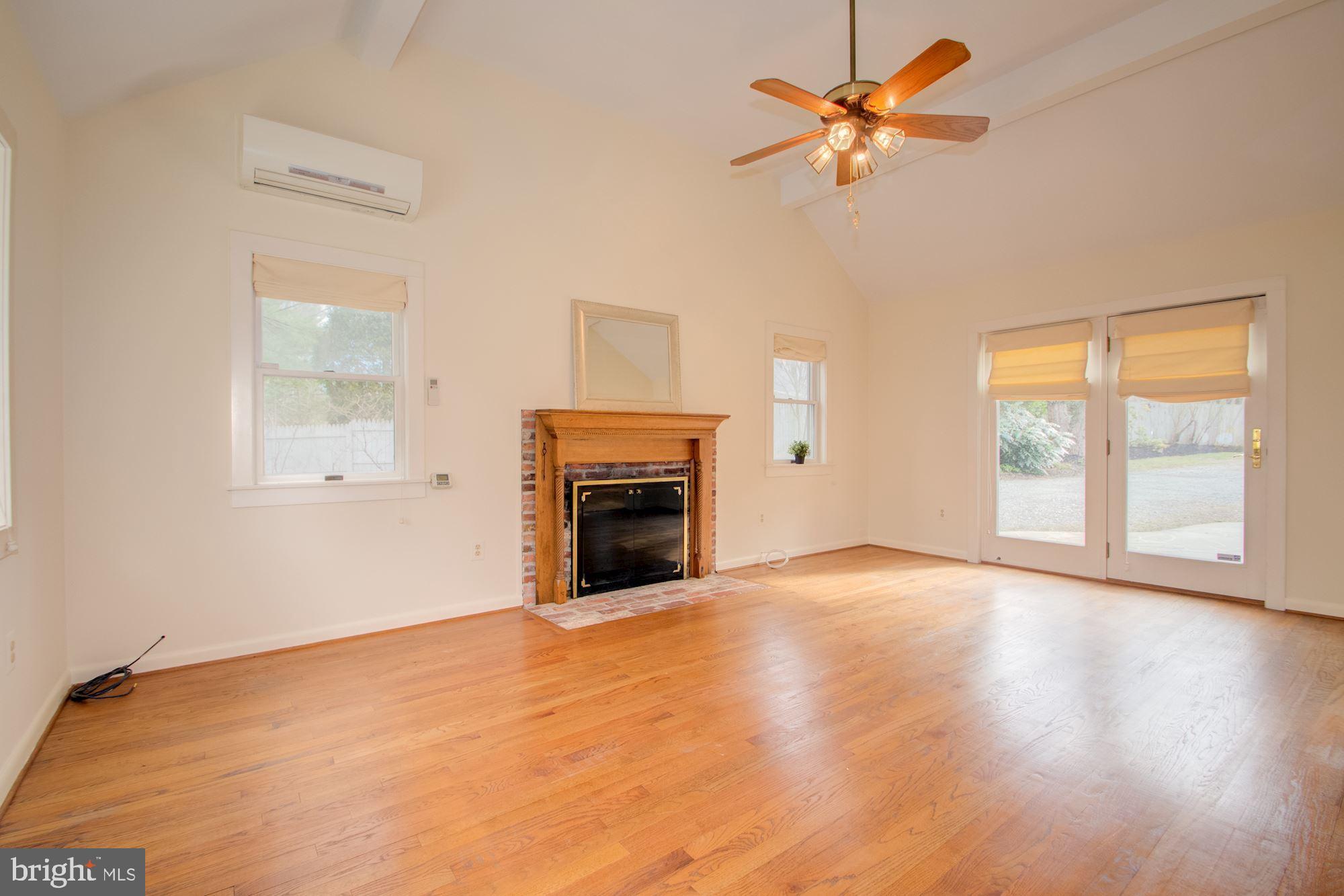 17825 Pond Road Ashton, MD 20861 - Photo 14 of 32 Family room w/beautiful hardwood floors, fireplace