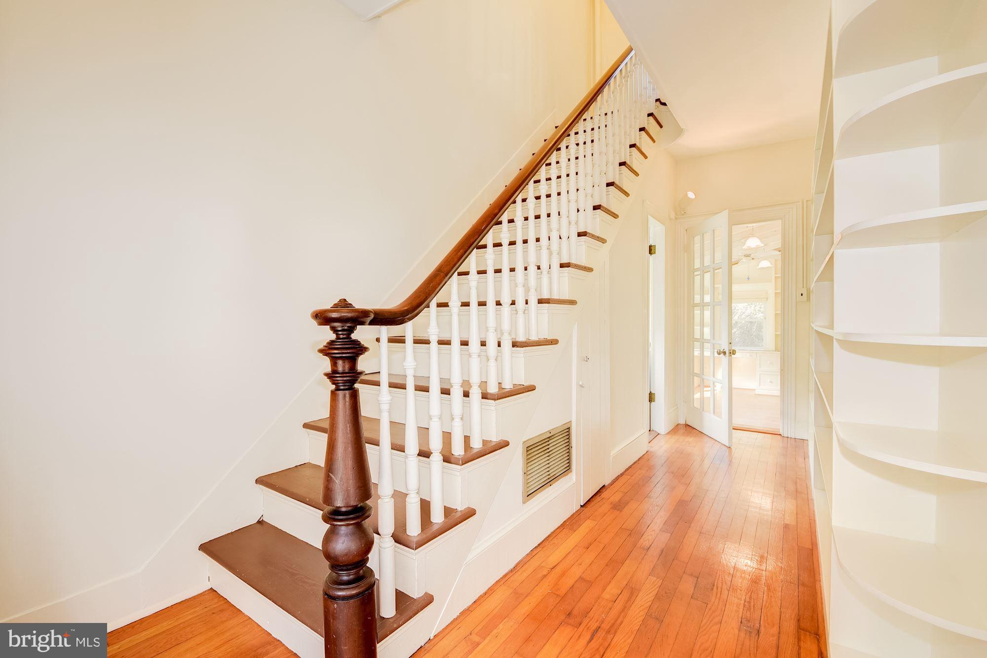 17825 Pond Road Ashton, MD 20861 - Photo 18 of 32 The foyer has bookshelves built by seller